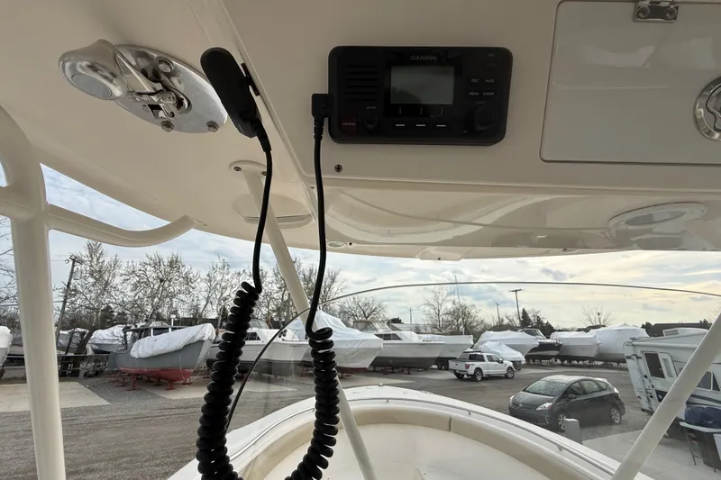 Slide: The Image of 2016 Pursuit S 280 Sport boat interior with Garmin device, parked in marina. - 37