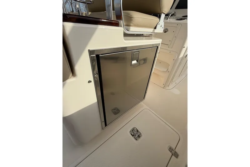 Slide: The Image of 2016 Pursuit S 280 Sport boat interior with stainless steel storage compartment. - 40