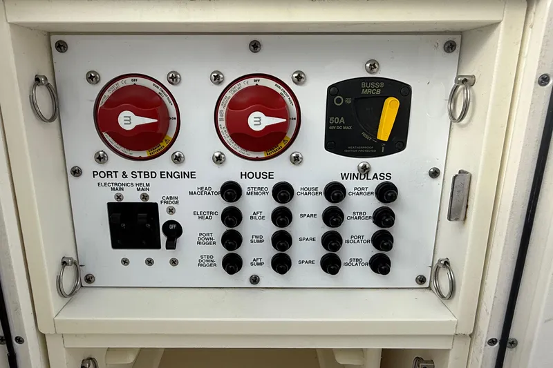 Slide: The Image of Control panel of a 2016 Pursuit S 280 Sport boat with switches and dials. - 44