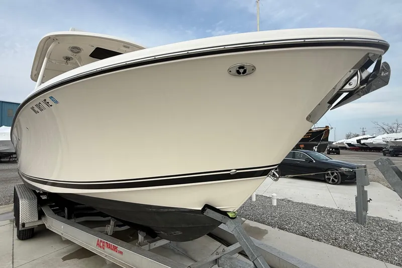 Slide: The Image of 2016 Pursuit S 280 Sport boat on trailer, side view, outdoors. - 5