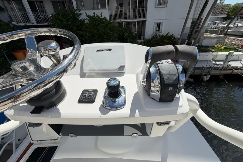 Slide: The Image of Control panel of a 2016 Boston Whaler 330 Outrage boat with Mercury throttle. - 18
