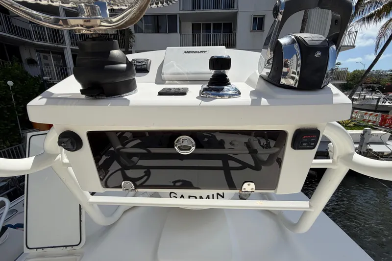 Slide: The Image of Control panel of a 2016 Boston Whaler 330 Outrage boat with navigation equipment. - 21