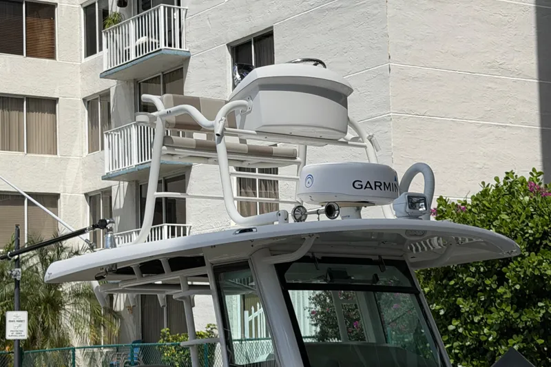 Slide: The Image of Boston Whaler 330 Outrage 2016 with Garmin radar, docked near residential building. - 28