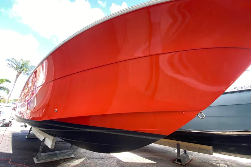 Slide: The Image of 2006 Hydra-Sports Vector 3300 CC boat with vibrant red hull on display. - 17