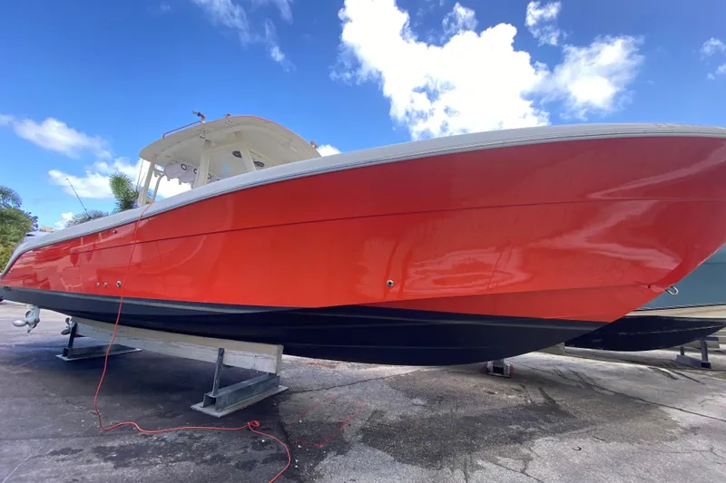 Slide: The Image of 2006 Hydra-Sports Vector 3300 CC boat with vibrant red hull on display. - 21