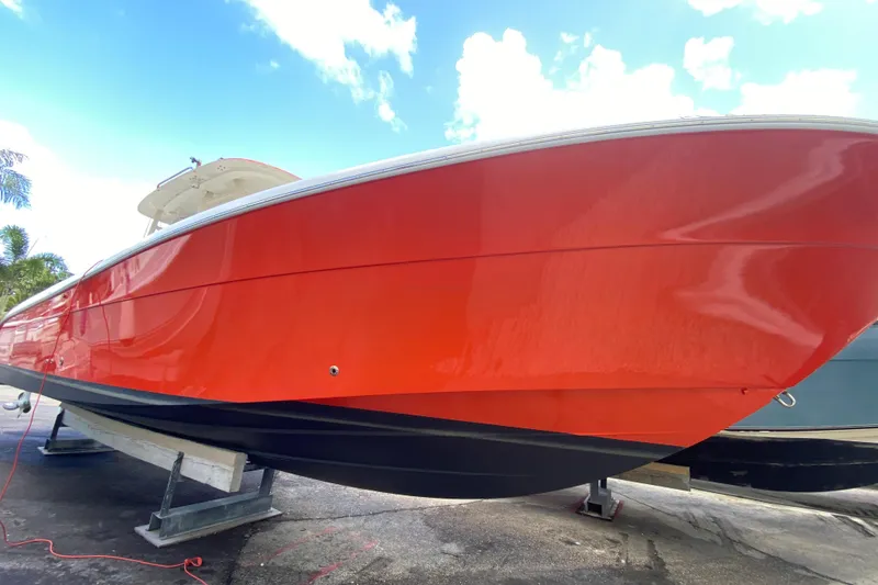 Slide: The Image of 2006 Hydra-Sports Vector 3300 CC boat with vibrant red hull on display. - 23