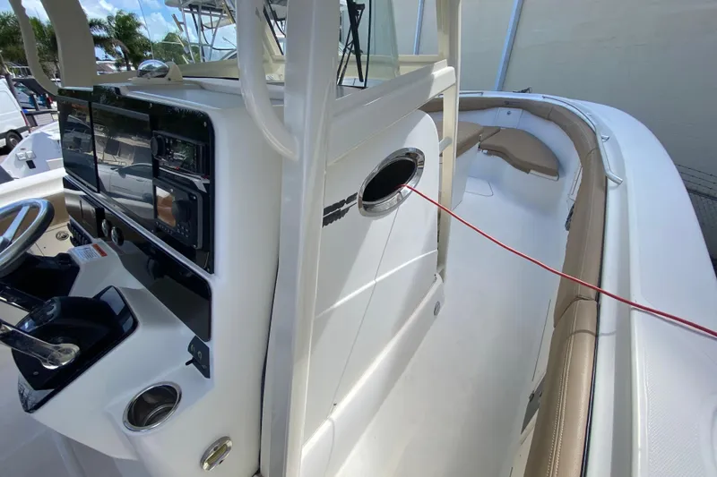 Slide: The Image of 2006 Hydra-Sports Vector 3300 CC boat interior with steering console and seating area. - 32