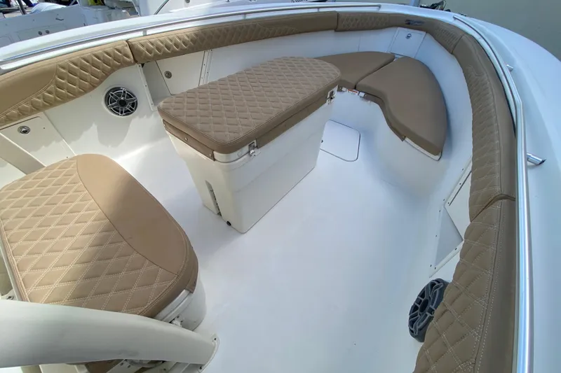 Slide: The Image of 2006 Hydra-Sports Vector 3300 CC boat interior with tan quilted seating and storage. - 36