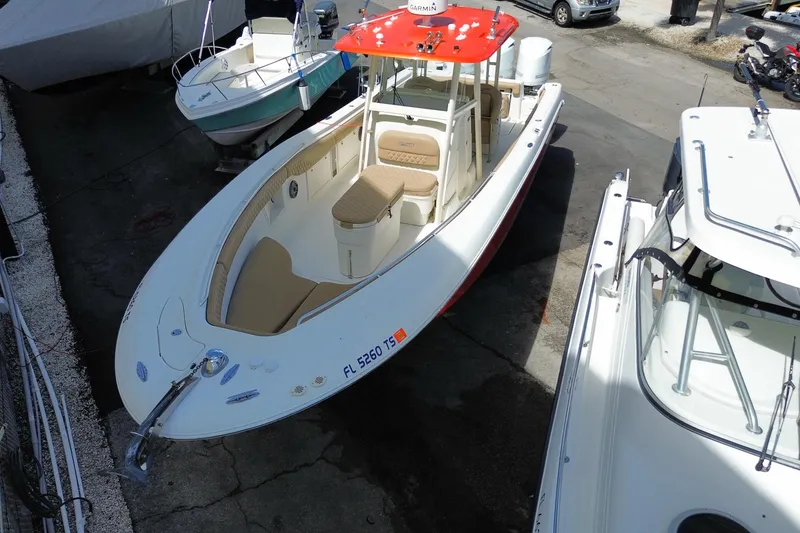 Slide: The Image of 2006 Hydra-Sports Vector 3300 CC boat with red canopy, docked in marina. - 4