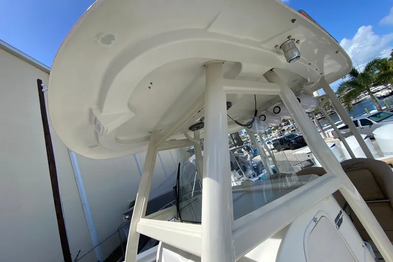 Slide: The Image of 2006 Hydra-Sports Vector 3300 CC boat with T-top and marina background. - 44