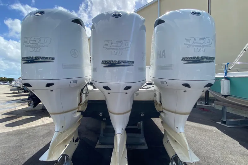 Slide: The Image of Triple outboard engines on a 2006 Hydra-Sports Vector 3300 CC boat. - 52
