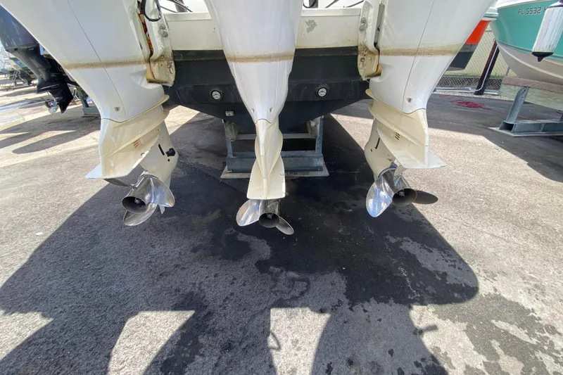 Slide: The Image of Triple outboard motors on a 2006 Hydra-Sports Vector 3300 CC boat. - 53