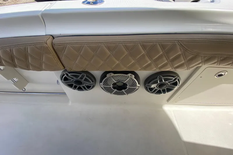 Slide: The Image of 2006 Hydra-Sports Vector 3300 CC boat interior with speakers and quilted upholstery. - 55