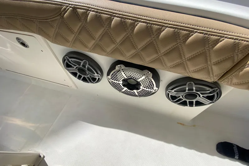 Slide: The Image of 2006 Hydra-Sports Vector 3300 CC boat interior with speakers and quilted leather upholstery. - 56