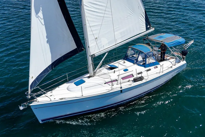 The Image of 2007 Hunter 38 sailboat cruising on open water. - 0