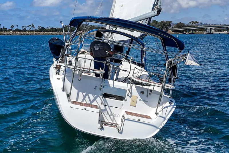 Slide: The Image of Sailing yacht Hunter 38 (2007) cruising on blue waters under clear skies. - 12