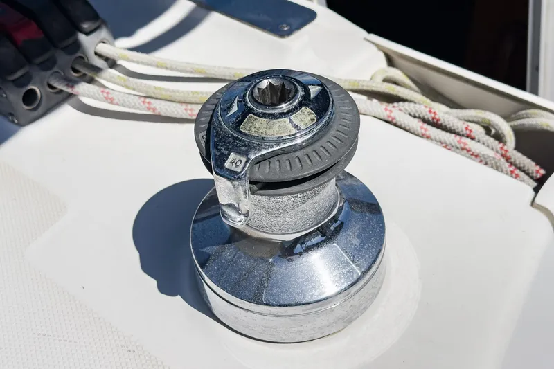 Slide: The Image of Chrome winch on 2007 Hunter 38 sailboat deck with ropes. - 27