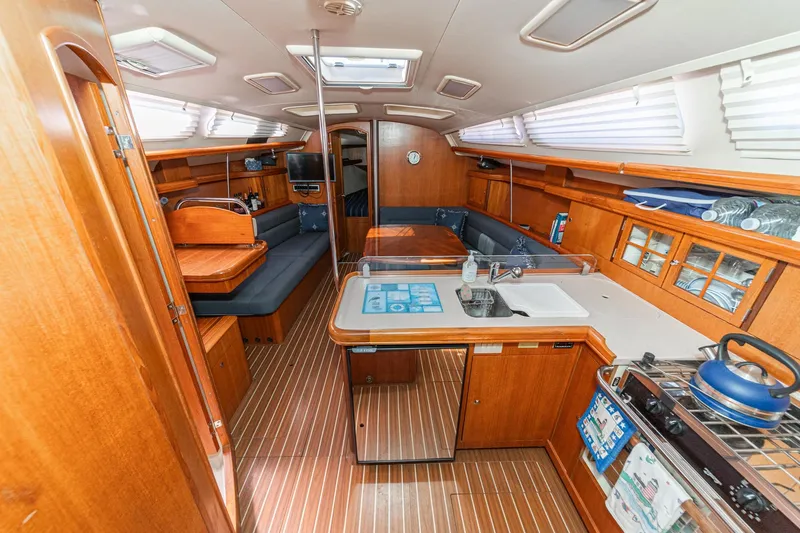 Slide: The Image of Interior of 2007 Hunter 38 sailboat with wood finish and modern amenities. - 30