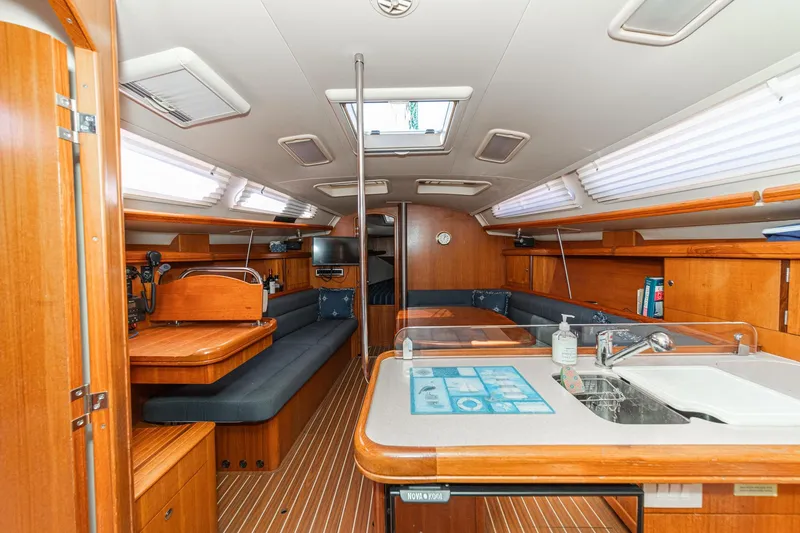 Slide: The Image of Interior of a 2007 Hunter 38 sailboat with wood finish and modern amenities. - 31