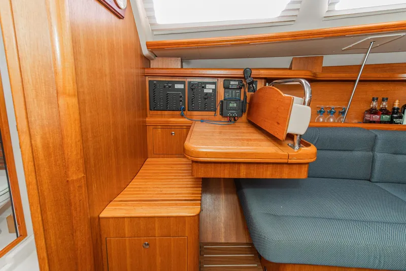 Slide: The Image of Interior of 2007 Hunter 38 sailboat with navigation station and wooden cabinetry. - 39