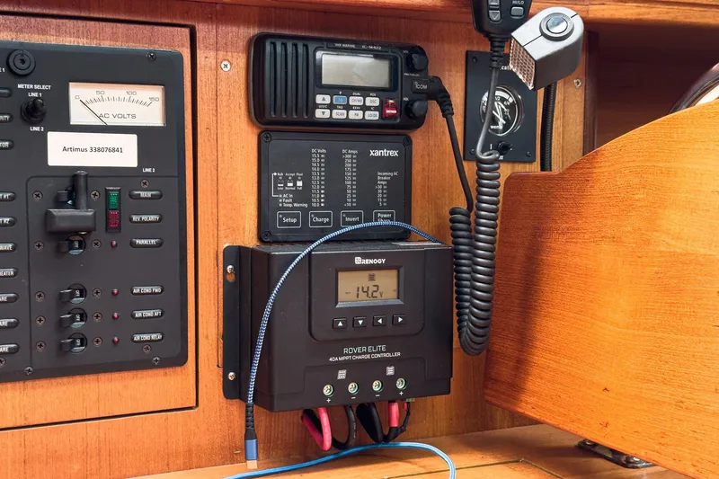 Slide: The Image of Electrical control panel on a 2007 Hunter 38 sailboat, featuring various instruments and devices. - 42