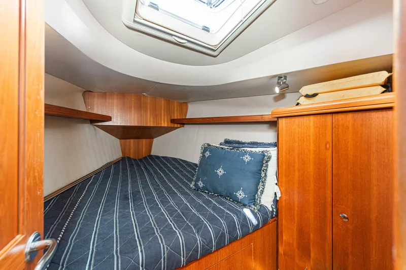Slide: The Image of Cozy cabin interior of 2007 Hunter 38 sailboat with wooden finish and skylight. - 43