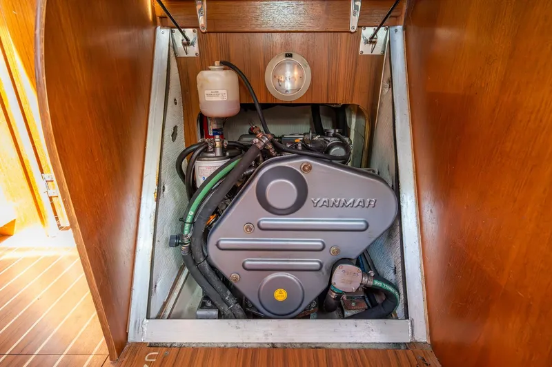 Slide: The Image of Engine compartment of a 2007 Hunter 38 sailboat featuring a Yanmar engine. - 49