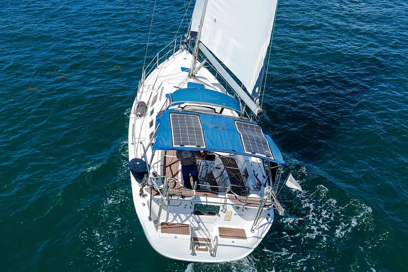 Slide: The Image of Sailing yacht Hunter 38 (2007) with solar panels on blue ocean waters. - 7
