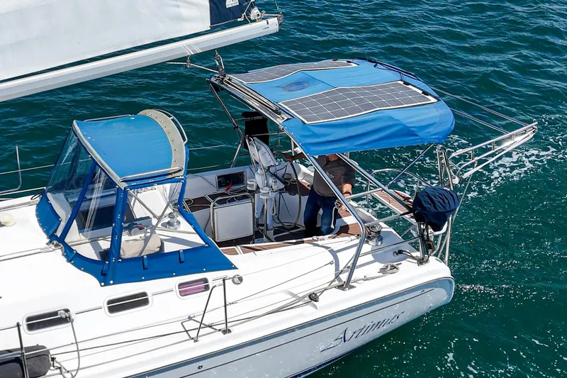 Slide: The Image of Sailing yacht Hunter 38, 2007 model, with solar panels, cruising on blue ocean waters. - 9