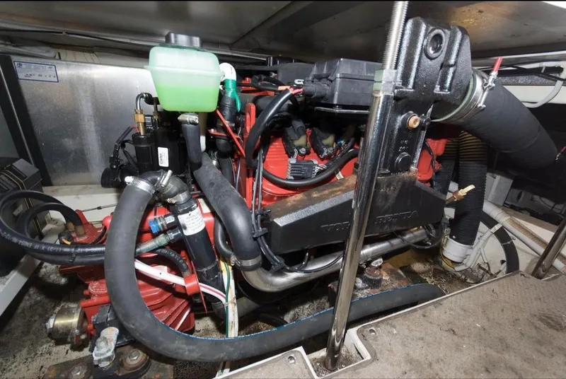 Slide: The Image of Engine compartment of a 2005 Carver 360 Sport Sedan, showcasing mechanical components and hoses. - 10