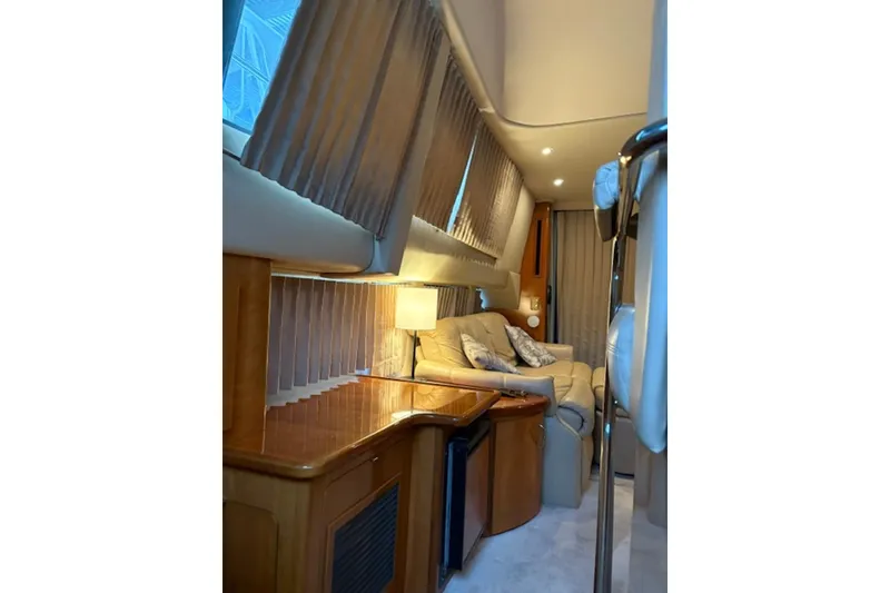 Slide: The Image of Luxurious bedroom interior of 2005 Carver 360 Sport Sedan with cozy bedding and wood cabinetry. - 14