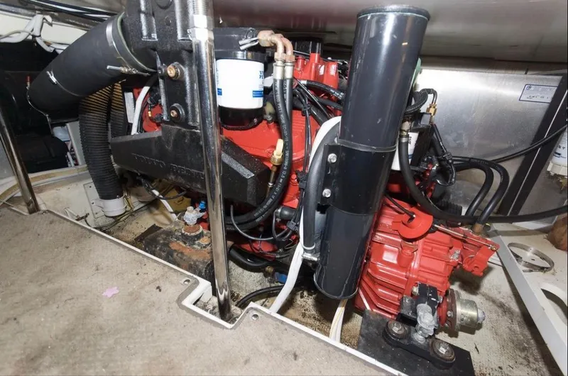 Slide: The Image of Engine compartment of a 2005 Carver 360 Sport Sedan, showcasing mechanical components and wiring. - 9