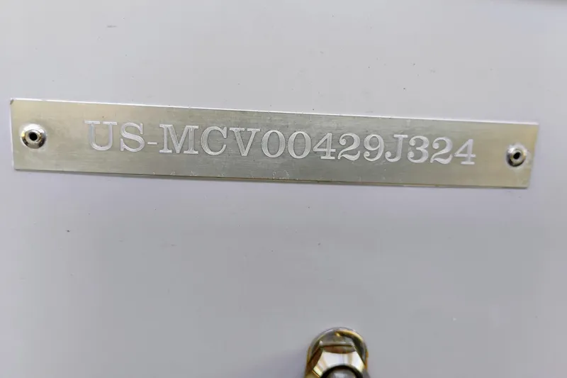 Slide: The Image of 2024 Clearwater 2500 Center Console boat identification plate with serial number. - 12