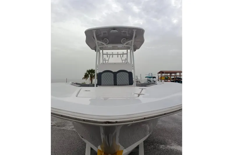 Slide: The Image of 2024 Clearwater 2500 boat, front view, overcast sky, dockside setting. - 5