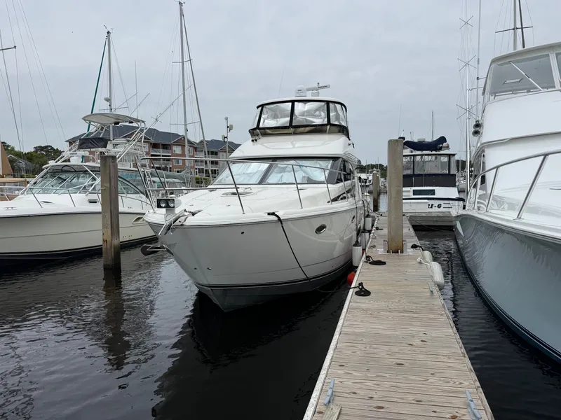 Slide: The Image of 2012 Meridian 441 Sedan yacht docked at marina. - 2