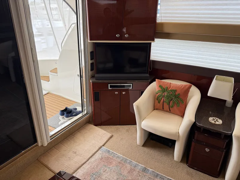 Slide: The Image of Interior of a 2012 Meridian 441 Sedan yacht with TV and armchair. - 31