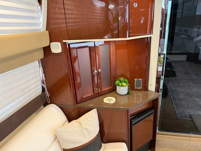 Slide: The Image of Interior of 2012 Meridian 441 Sedan with wood cabinetry and plants. - 32