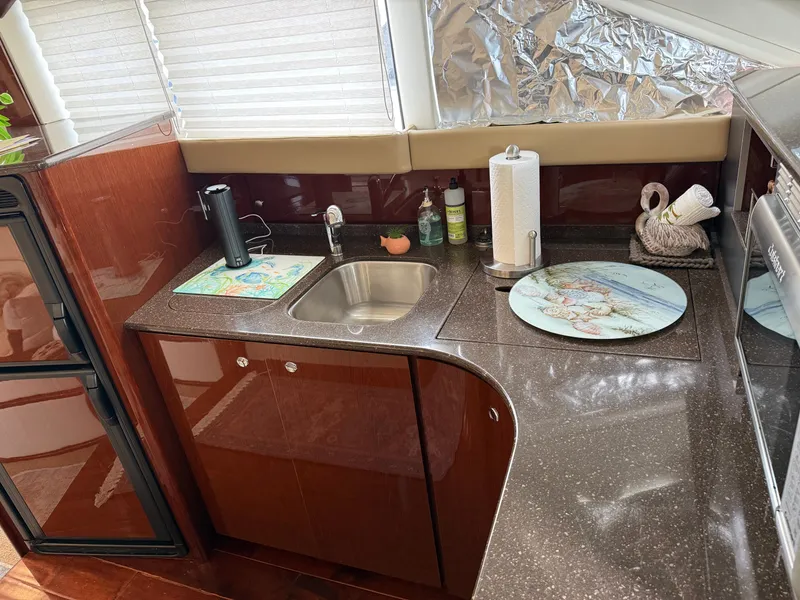 Slide: The Image of Kitchen area in a 2012 Meridian 441 Sedan yacht. - 38