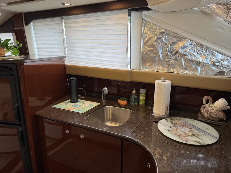 Slide: The Image of Interior of Meridian 441 Sedan yacht, kitchen with sink and countertop. - 41