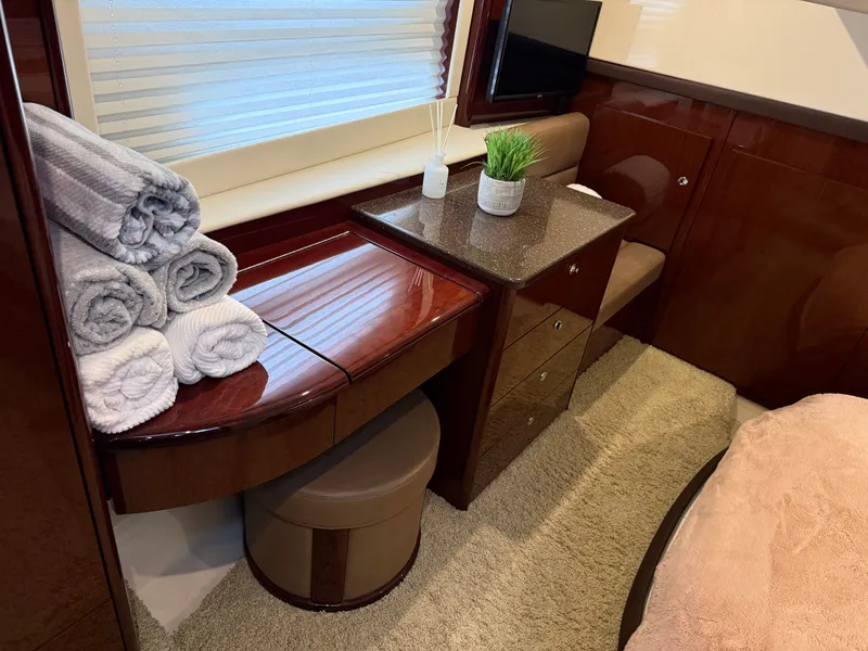 Slide: The Image of Interior of a 2012 Meridian 441 Sedan yacht with luxurious wood furnishings. - 42