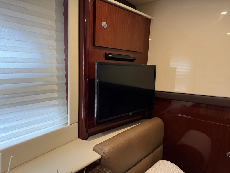 Slide: The Image of Interior of a 2012 Meridian 441 Sedan with TV and wood paneling. - 44