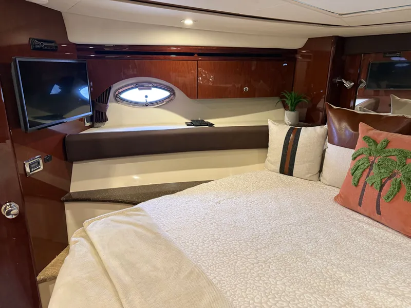 Slide: The Image of Interior of 2012 Meridian 441 Sedan yacht featuring a luxurious bedroom. - 49