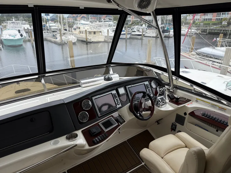 Slide: The Image of Interior view of 2012 Meridian 441 Sedan cockpit in marina. - 6