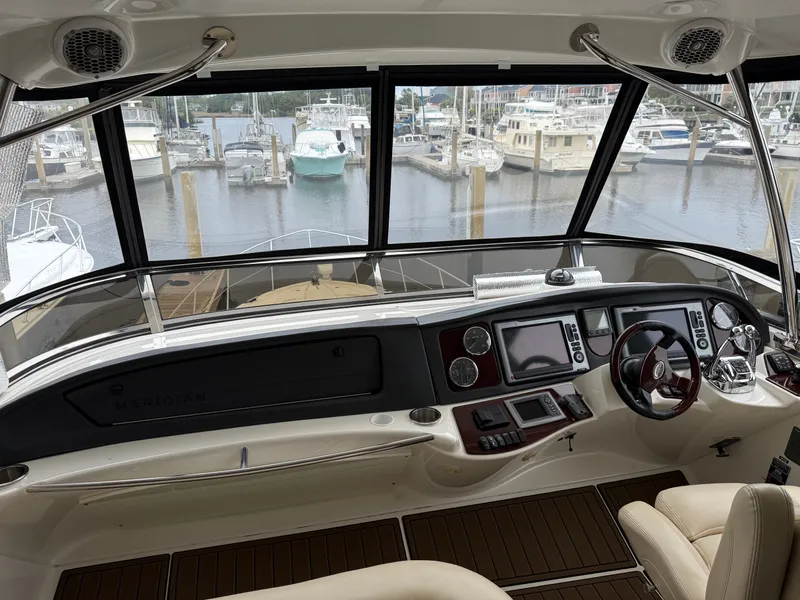 Slide: The Image of Interior view of 2012 Meridian 441 Sedan yacht at the marina. - 7