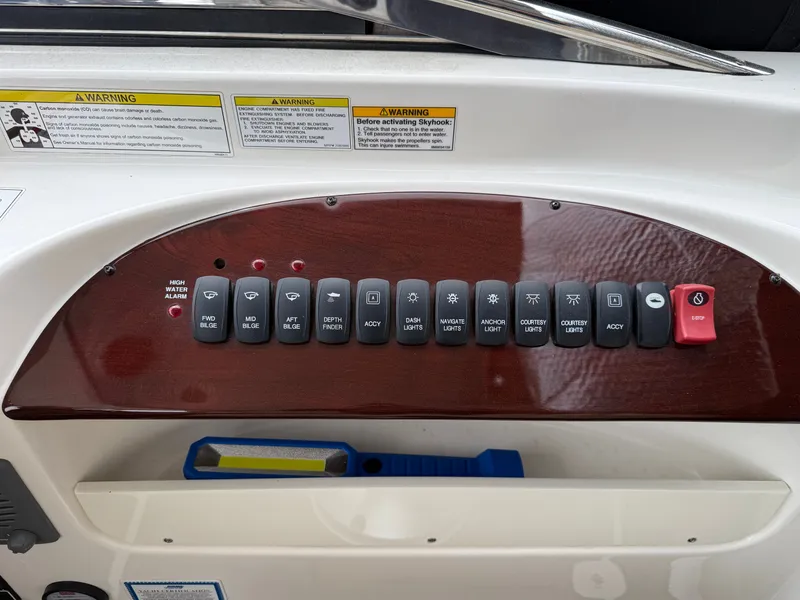 Slide: The Image of Control panel of a 2012 Meridian 441 Sedan with switches and warning labels. - 9