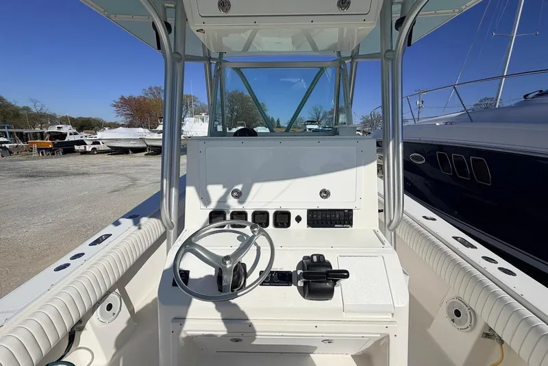 Slide: The Image of 2006 Regulator 29 Forward Seating boat console with steering wheel and controls. - 4
