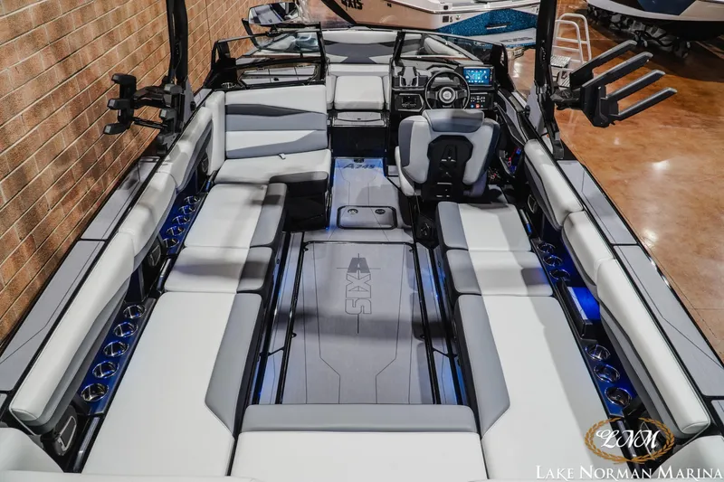 Slide: The Image of 2026 Axis A245 boat interior with spacious seating and modern dashboard at Lake Norman Marina. - 10