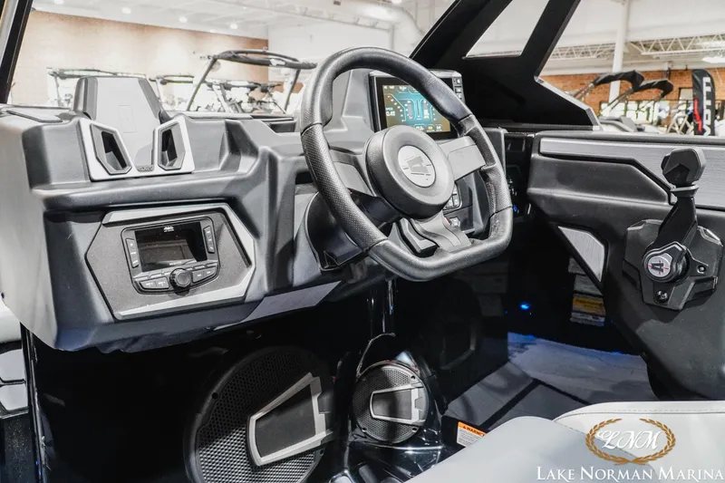 Slide: The Image of 2026 Axis A245 boat interior with modern steering wheel and dashboard controls. - 15