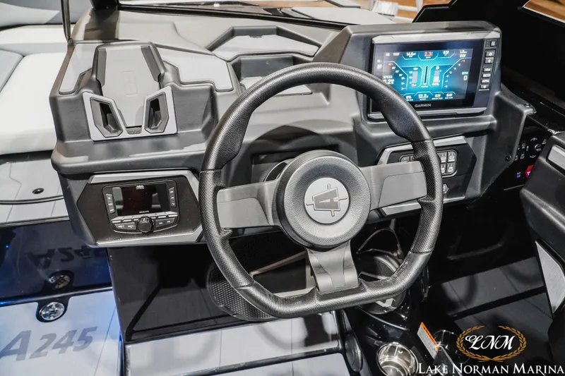 Slide: The Image of Cockpit of 2026 Axis A245 boat with steering wheel and digital display. - 16