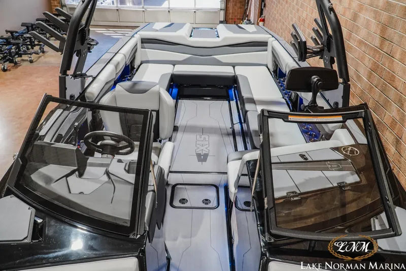 Slide: The Image of 2026 Axis A245 boat interior with sleek seating and modern dashboard at Lake Norman Marina. - 19